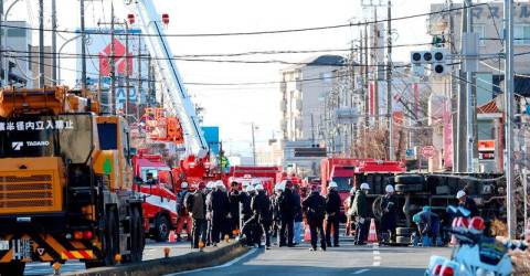 1.2 million in Japan told to use less water to help sinkhole rescue