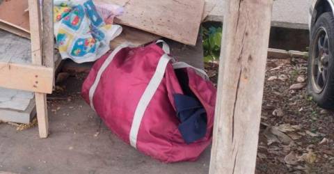 Newborn baby found abandoned in a bag under car porch