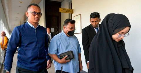 Ex-CEO, wife, son charged with laundering over RM150 million